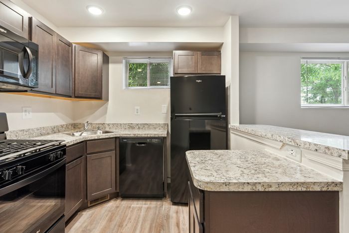 Open Kitchen with Black Appliances