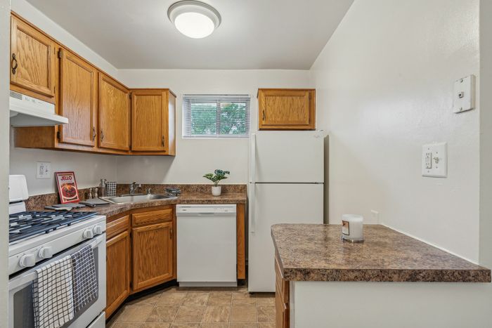 Classic Kitchen with White Appliances and Gas Range