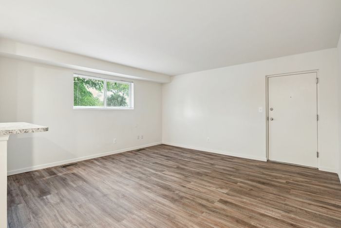 Living Room with Wood Flooring. Breakfast Bar Counter.