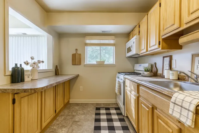 Kitchen with pantry storage and breakfast bar