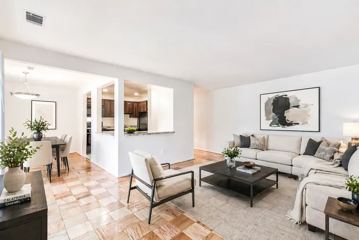 Living room, dining room with parquet floors and natural sunlight