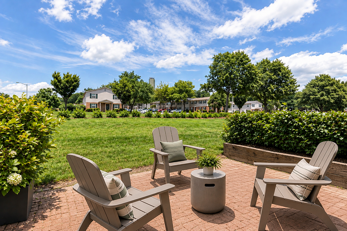 Outdoor community area at Lake Village Apartments with landscaped grounds
