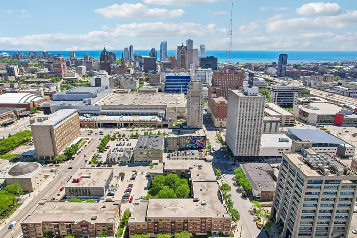 Vibrant aerial view of downtown Milwaukee showcasing modern architecture, lush greenery, and the serene lakefront.
