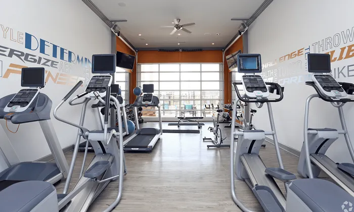 Modern fitness center with state-of-the-art cardio machines, sleek treadmills, and an inspiring ambiance for an energizing workout.