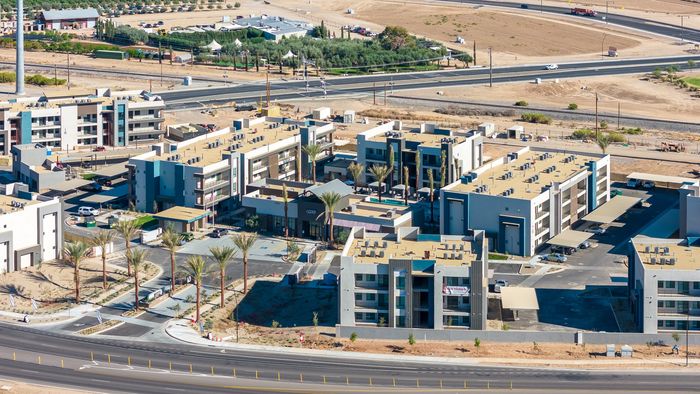 Apartments In Queen Creek, AZ For Rent - Acero Harvest Station - Aerial View Of The Entire Property Featuring Multiple Housing Buildings And The Leasing Office Right In The Center In Front Of The Pool Area