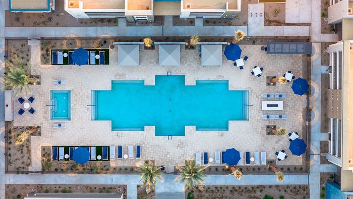 Three-Bedroom Apartments in Queen Creek, AZ - Acero Harvest Station - Swimming Pool with a Spa, Cabana Seating, and a Fire Pit