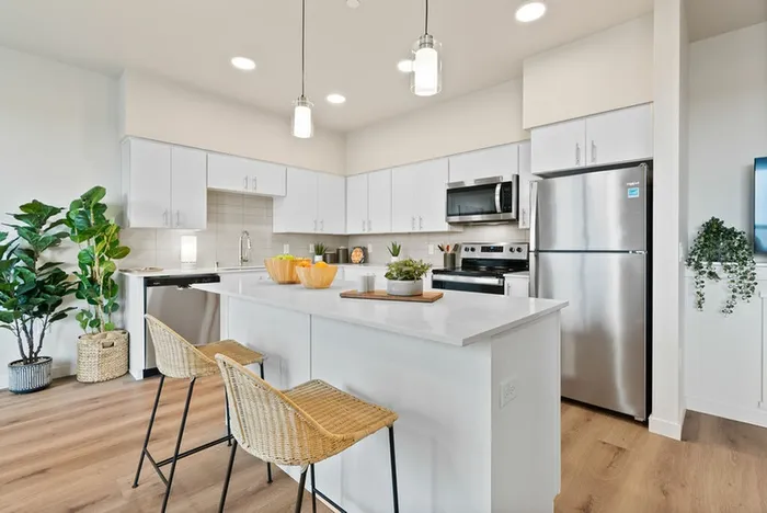2 Bedroom Apartments in Vancouver, WA - Bennington on First - Kitchen - Stainless Steel Appliances - Quartz Countertops - Wood-Style Flooring - White Cabinets