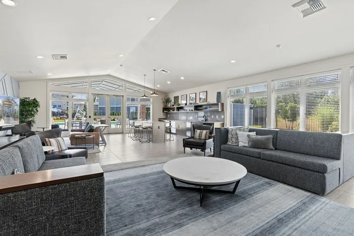 open concept clubhouse with kitchen and seating