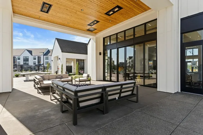 Two-Bedroom Apartments in Vancouver, WA - Bennington on First - Community Patio - Patio Couch - Wood Shading