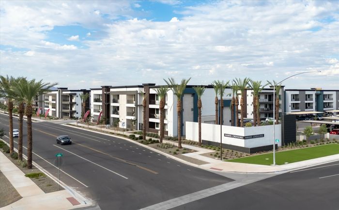 Mesa Apartments - Acero Hawes Crossing - Building Exterior with Sidewalk Access, Property Name Building Label, and Blue Skies