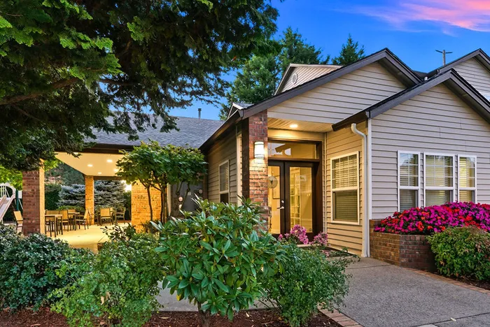 Charming suburban home with lush garden and cozy patio, perfect for outdoor relaxation.
