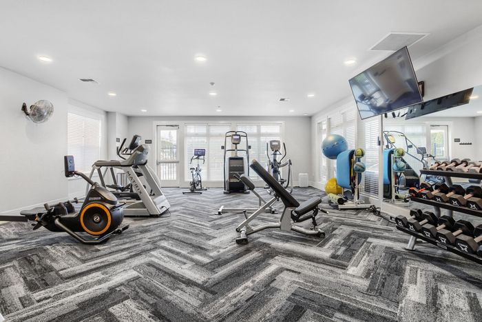 Apartments in Vancouver WA - Acero Jensen Park - Fitness Center Featuring Free Weights and Elliptical Machines