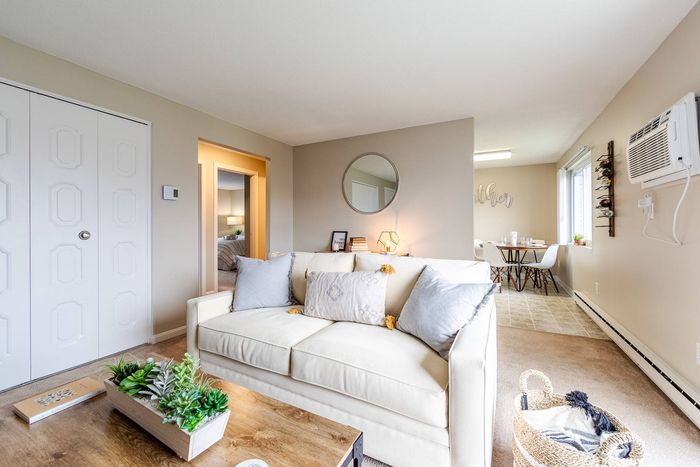 The pleasant living room creates a warm and comfortable atmosphere perfect for daily relaxation.  | Princeton Reserve | Apartment in, Dracut MA