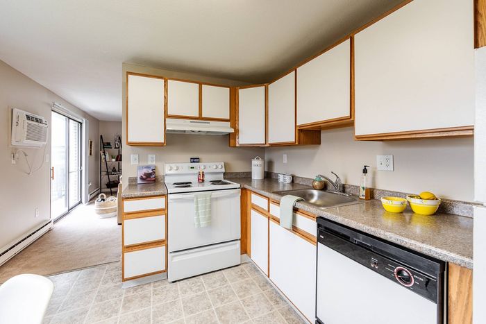Modern, fully equipped kitchen featuring ample counter space and updated appliances at our welcoming apartments in Dracut, MA. | Princeton Reserve | Apartments in Dracut MA
