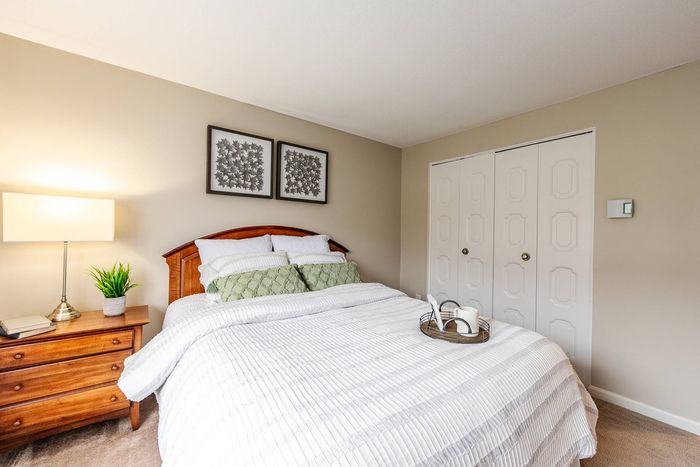 Unwind after a long day in your roomy, plushly carpeted bedroom at our pet-friendly apartments in Dracut, MA. | Princeton Reserve | Dracut MA Apartments
