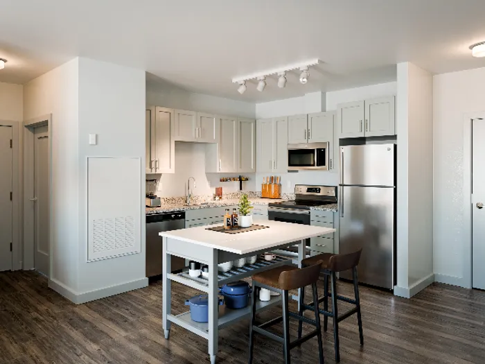 Prepare meals and entertain guests in our community kitchen featuring appliances, prep space, and dining areas. Cooking made convenient.  | The Chandler |  The Chandler Apartments