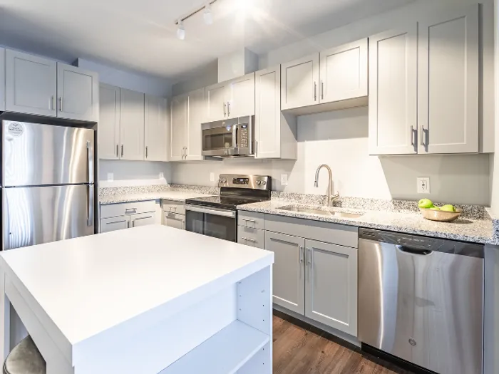 The updated kitchen features fresh finishes, quality appliances, and improved functionality for daily cooking needs.  | The Chandler |  The Chandler Apartments