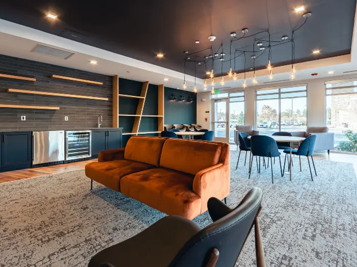 Gather with friends or meet your neighbors in the beautifully designed community room, offering a warm and comfortable atmosphere at our pet-friendly apartments in Bedford, NH. | The Chandler | Apartment in,Bedford NH