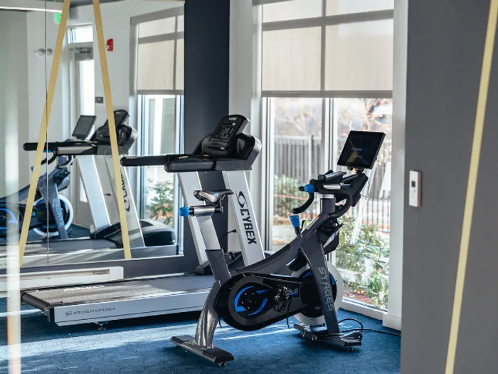 The fully equipped fitness center creates an energizing yet comfortable atmosphere perfect for your daily workout routine at our welcoming apartments in Bedford, NH. | The Chandler | Apartment in,Bedford NH