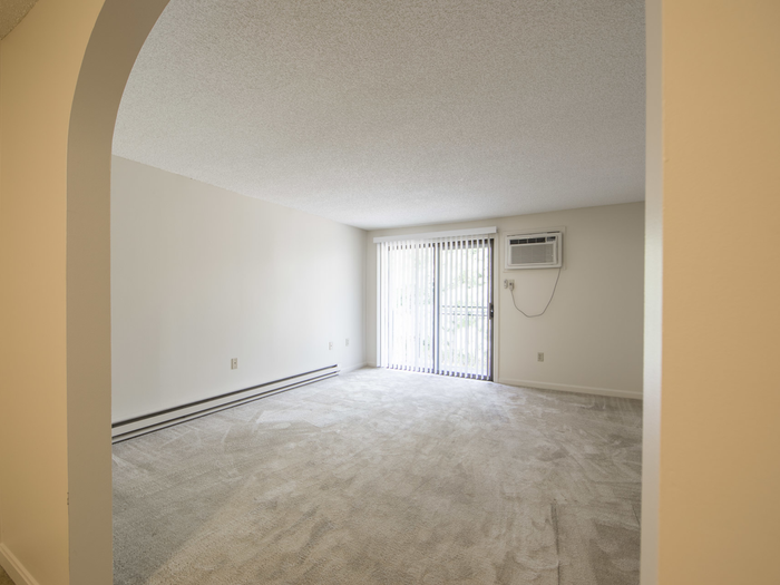 Spacious living area with sliding doors to balcony | Princeton Place | Apartments For Rent Near Worcester MA