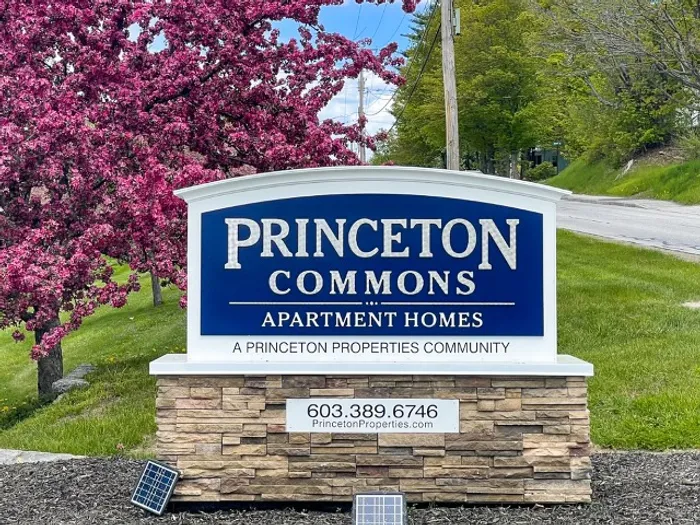 Monument-style sign in front of Princeton Commons apartment community in Claremont, NH.