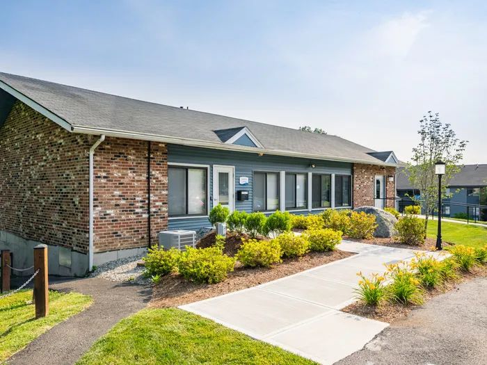 Exterior showing landscaping and sidewalk at Princeton Bradford, apartments near Haverhill, MA.