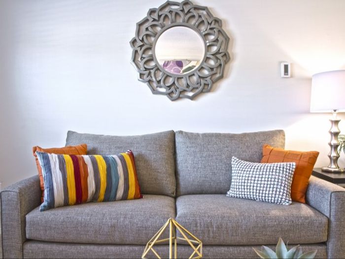 The pleasant living room creates a warm and comfortable atmosphere perfect for daily relaxation. | Princeton Dover Apartments | Apartment in Dover, NH