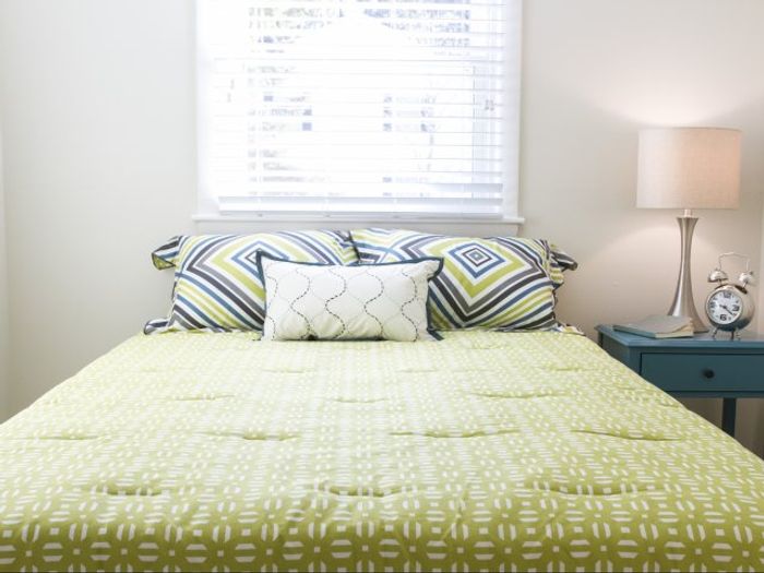 This elegant primary bedroom features sophisticated design elements and comfortable proportions for restful nights. | Princeton Dover Apartments | Princeton Dover Apartments