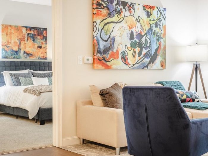 Living room and doorway into bedroom at Mill & 3 Apartments | Apartments For Rent Chelmsford MA