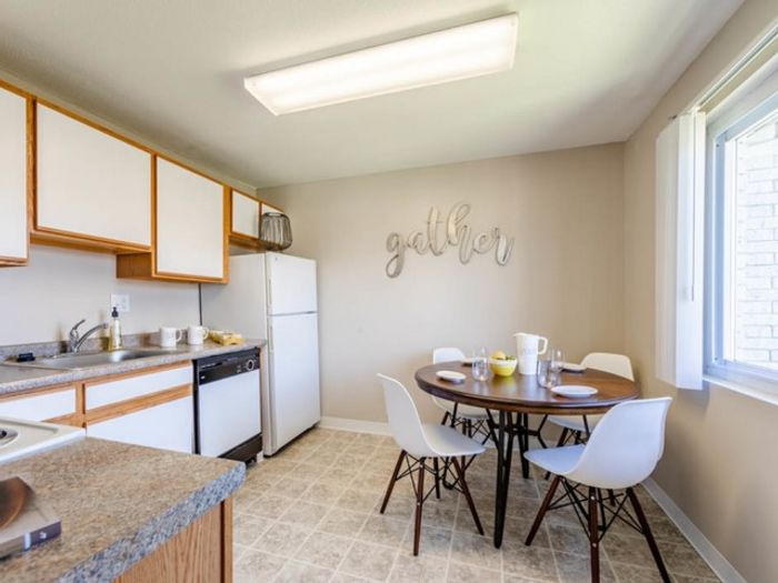 Beautifully updated kitchen with sleek finishes and plenty of cabinet storage space at our scenic apartments in Dracut, MA. | Princeton Reserve | Apartments For Rent Dracut MA