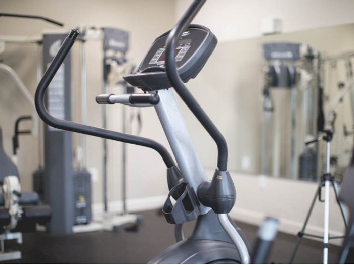 Achieve your daily health and wellness goals without leaving home in the on-site fitness center at our pet-friendly apartments in Dracut, MA. | Princeton Reserve | Dracut MA Apartments