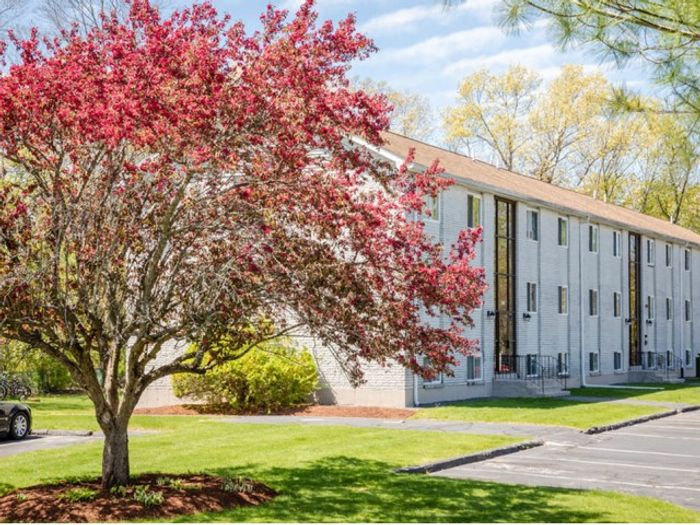 The overlooking grounds provide peaceful property views with mature landscaping and open space. | Princeton Reserve | Dracut Apartments