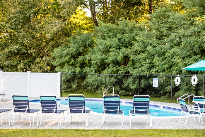 Our pool's water feature adds visual appeal and soothing sounds while enhancing your swimming and relaxation experience. | Princeton Dover Apartments | Princeton Dover Apartments