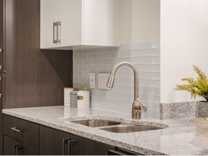 New Modern Kitchens with granite countertops and tile backsplash at Mill & 3 Apartments | Apartments For Rent In Chelmsford MA