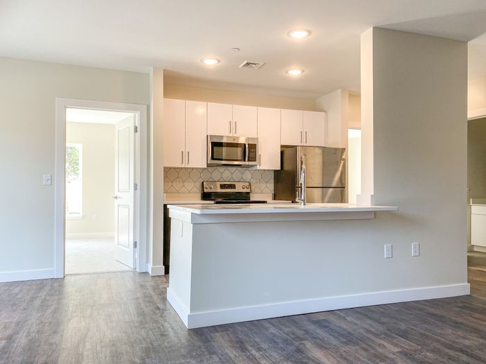 This prep-friendly kitchen maximizes workspace and storage with thoughtful layout designed for efficient cooking. | Princeton Dover Apartments | Dover Apartments