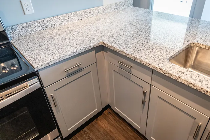 This inviting kitchen creates a warm gathering space where cooking and conversation flow naturally together.  | The Chandler |