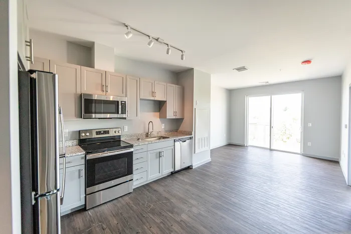 The updated kitchen features fresh finishes, quality appliances, and improved functionality for daily cooking needs.  | The Chandler |  The Chandler Apartments