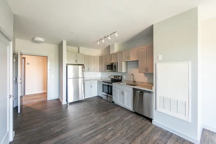 This renovated kitchen combines new finishes with improved layout for enhanced cooking and entertaining experience. | The Chandler |
