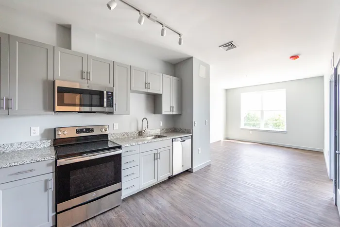 Channel your inner chef in our gourmet kitchen space ideal for entertaining friends or hosting cooking demonstrations. | The Chandler | Bedford Apartments
