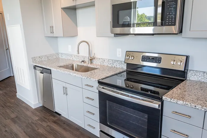 The gourmet-inspired kitchen features premium finishes and functional design elements for serious cooking enthusiasts.  | The Chandler | Apartment in,Bedford NH