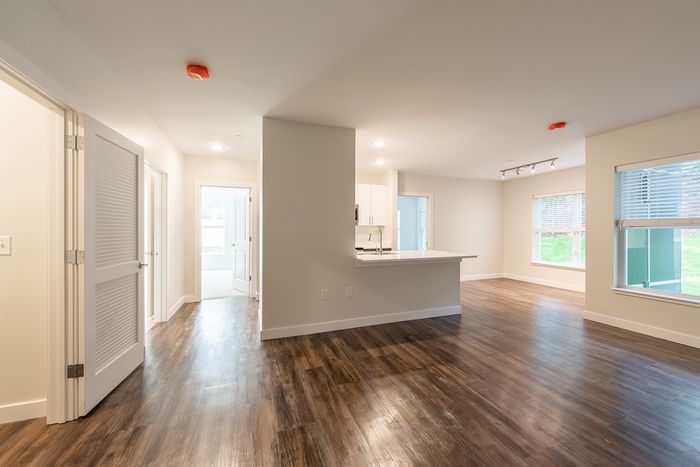 The pleasant living room creates a warm and comfortable atmosphere perfect for daily relaxation. | Princeton Dover Apartments | Apartment in Dover, NH