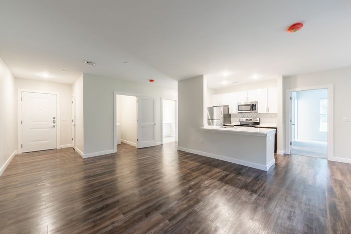 This combination living/dining area maximizes space while creating distinct zones for relaxation and meals. | Princeton Dover Apartments |