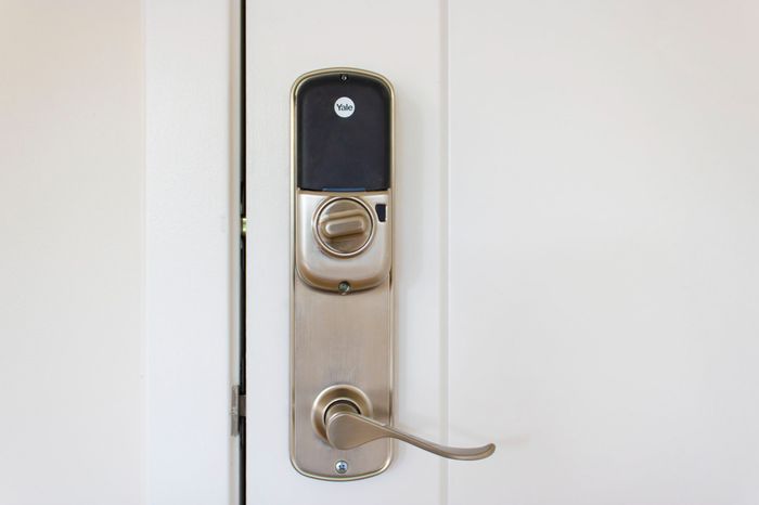 The James Apartments | Close-up of a smart Yale door lock system installed on a white door | Luxury Apartments in Haverhill MA