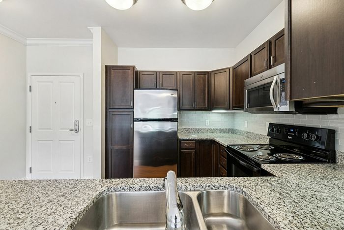 The gourmet-inspired kitchen features premium finishes and functional design elements for serious cooking enthusiasts.  | Princeton Westford |