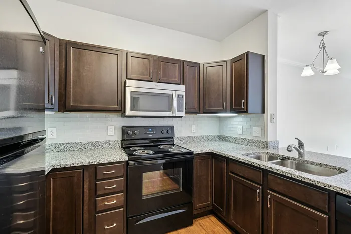 Discover the joy of cooking in an updated kitchen boasting fresh finishes and quality appliances designed for your lifestyle at our scenic apartments in Westford, MA. | Princeton Westford | Princeton Westford Apartments