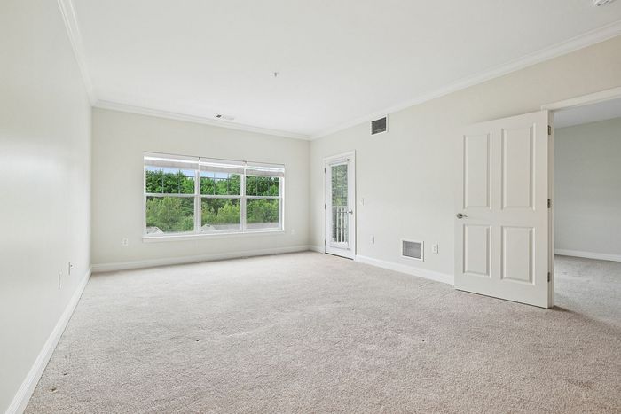 The airy bedroom provides bright, open atmosphere with natural light and comfortable proportions throughout.  | Princeton Westford | Westford Apartments