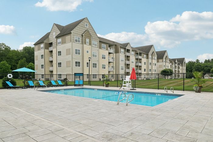 Cool off and relax in the beautiful community swimming pool at our pet-friendly apartments in Westford, MA. | Princeton Westford | Apartment in, Westford MA