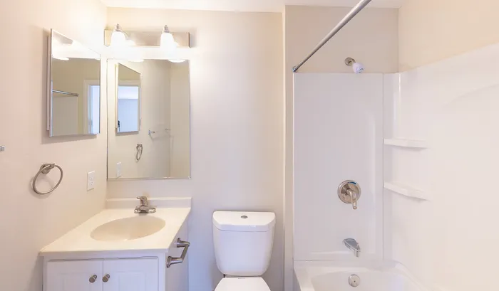Bright and inviting bathroom featuring a sleek vanity, a modern bathtub with subtle shelving, and soft ambient lighting.Your spacious kitchen offers generous square footage with room for multiple people and all your cooking essentials. | The Royal Crest | Apartment in,North Andover MA