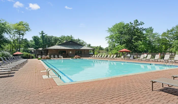 Your community pool area offers premium lounge seating and a refreshing atmosphere for cooling off and social gatherings. | The Royal Crest | Apartment in North Andover, MA