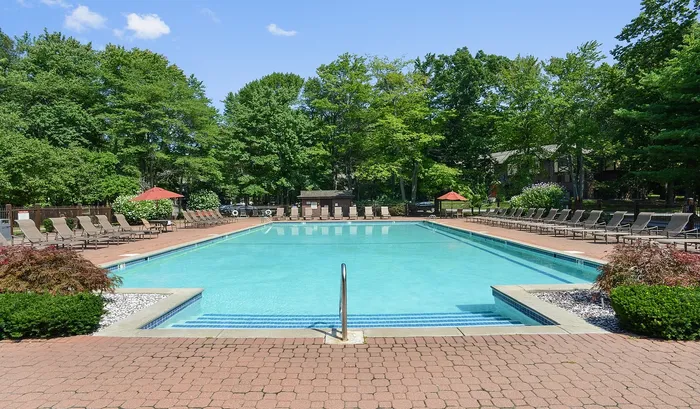 This beautifully maintained swimming pool area serves as the ultimate social hub for summer fun and relaxation. | The Royal Crest | Apartment in North Andover, MA